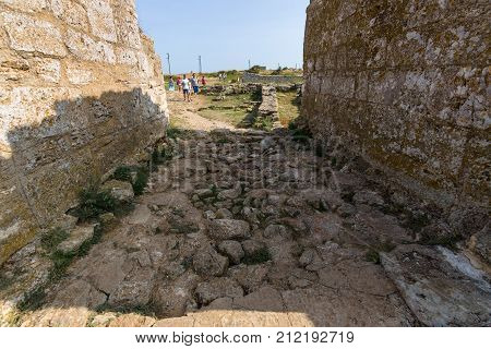 CAPE KALIAKRA BULGARIA - AUGUST 23 2017: Tourists on the ruins of the medieval fortress of Kaliakra.