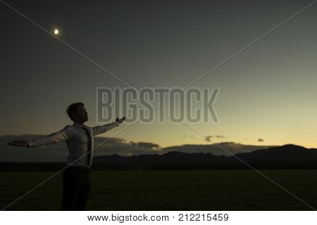 Businessman Celebrating A New Dawn Outdoors