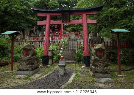 Small shrine of frogs at the Fushimi Inari Shrine, Kyoto, Japan