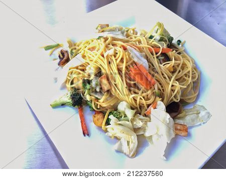 Fried Noodles With Vegetables In White Dish .vegan Or Vegetarian Food. Thai Cuisine
