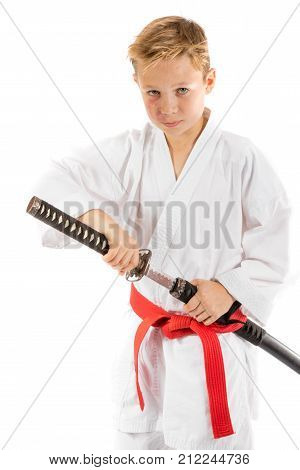 Pre-teen boy with a samurai sword isolated on a white background