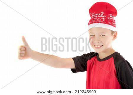 Pre-teen boy wearing a santa hat looiking happy isolated on white