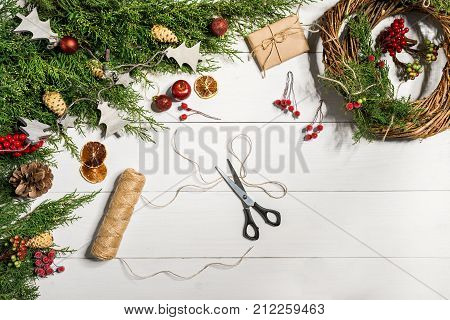 How to make christmas door wreath. The working process. The decorator's workplace. Top view. Copy space. Still life. Flat lay.