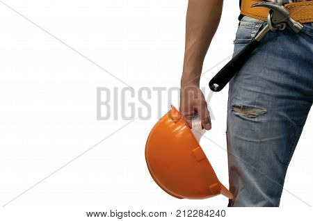 Builder worker holding in hand a helmet and hammer in mounting belt isolated on white background with copy space. Construction background. Repair background concept.