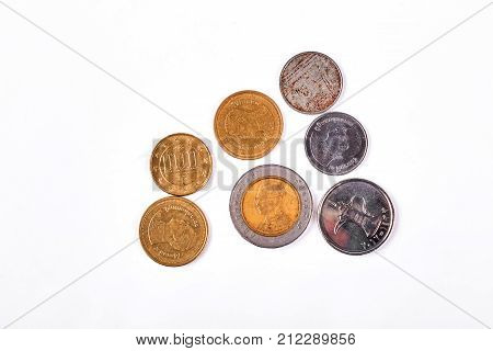 Gold and silver ancient coins. Different kinds of antique coins isolated on white background.
