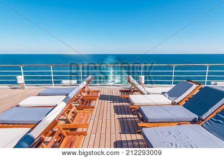 Cruise Ship Vacation. Sea Travel Concept with Deckchairs on the Vessel Deck.
