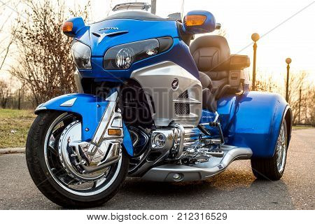 KHABAROVSK, RUSSIA - May 3, 2017: Honda Trake three-wheeled motorbike hand-assembled stands on flat ground in the street on Khabarovsk on may 3, 2017