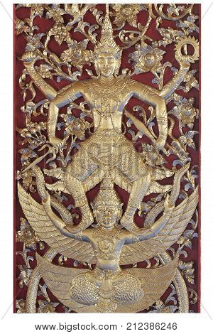 wooden carving sclupture of Ramakien Performance in the middle of heaven forest isolated on white backgrounds, home decoration, flying monster titan and angel with thai culture crafting