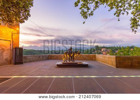 A Sculpture In A Square In Pitigliano, A Medieval Village Near Grosseto In Tuscany.