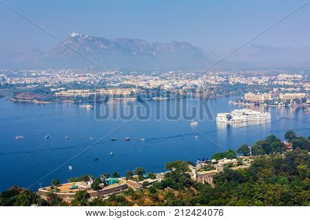 Aerial view of Lake Pichola with Lake Palace (Jag Niwas) and Udaipur city. Udaipur, Rajasthan, India