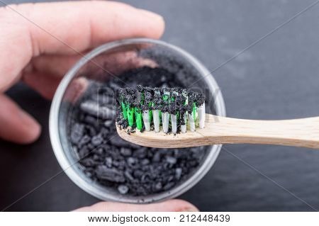 Charcoal On A Toothbrush To Whiten Teeth