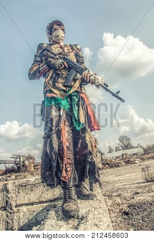 Post apocalyptic survivor creature with homemade weapons