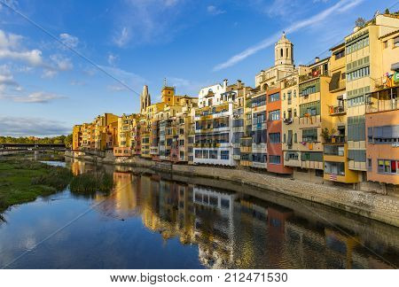 Colorful houses on the banks of the Onyar river in the historical part of Girona