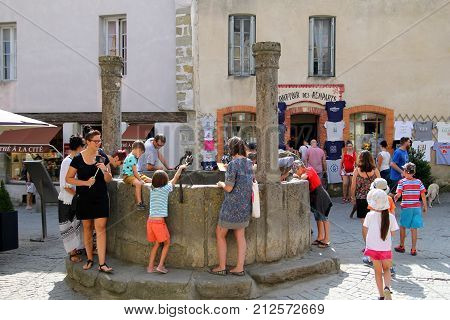 Carcassonne, Languedoc-roussillon, France - August 24 2017: Children And Other Tourists Looking Down