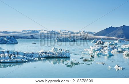 Beatufil vibrant picture of icelandic glacier and glacier lagoon with water and ice in cold blue tones, Iceland, Glacier Bay