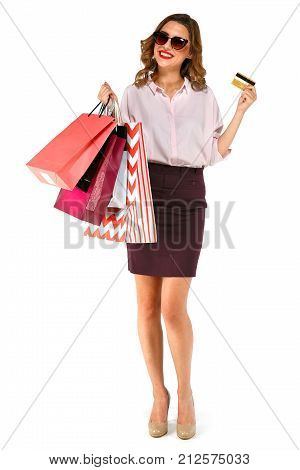Happy Woman Posing With Colorful Shopping Bags And Gold Credit Card On White Background