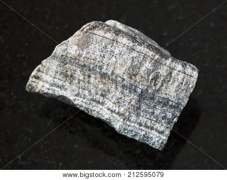 Piece Of Rough Skarn Stone On Dark Background