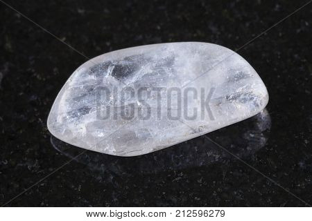 Tumbled Natrolite Gemstone On Dark Background