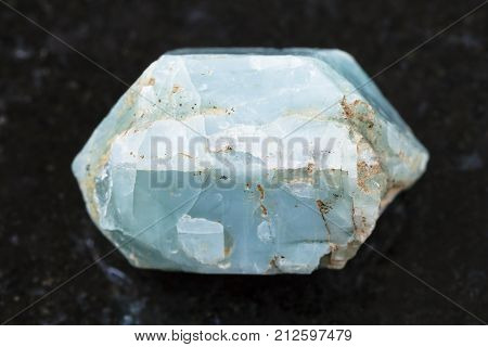 Raw Crystal Of Blue Apatite Gemstone On Dark
