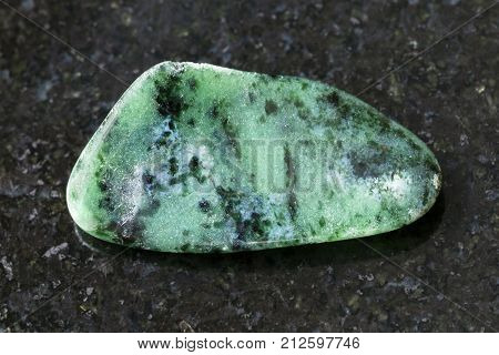 Polished Zoisite Gemstone On Dark Background