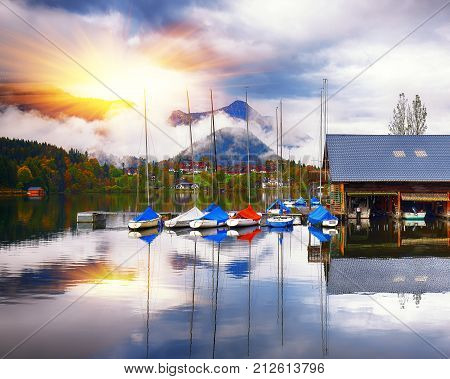 Yacht dock on the lake. Misty morning on the lake Grundlsee Location: resort Grundlsee Liezen District of Styria Austria Alps. Europe.