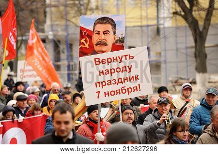 Orel, Russia, November 7, 2017: October Revolution Anniversary Meeting. People Marching With Stalin