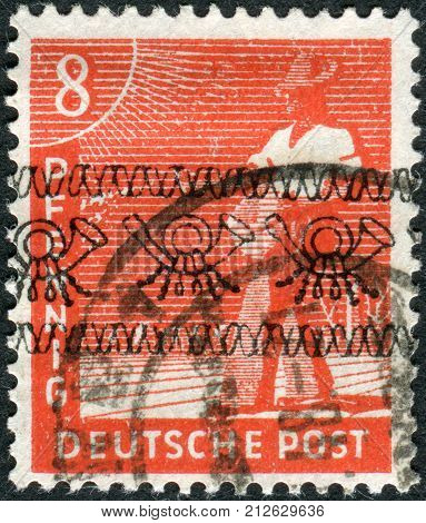 GERMANY - CIRCA 1947: Postage stamp printed in Germany (overpint Type A: US and British occupation zone) shows the sower circa 1947