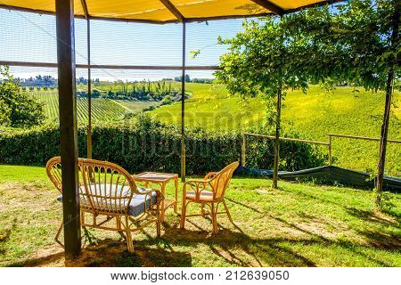 Relaxation sitting area with magnificent view of vineyard in Tuscany, Italy
