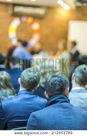 Conference and Mediation at The Round Table.Group of Professional Mediators Presenting at the Round Table on Stage Before the Audience.Vertical Shot