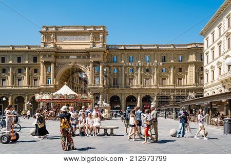 Florence, Italy - August 23, 2016: Square of the Republic in Florence, Piazza della Repubblica, a sunny day of summer. It is a city square on the site of the old roman forum