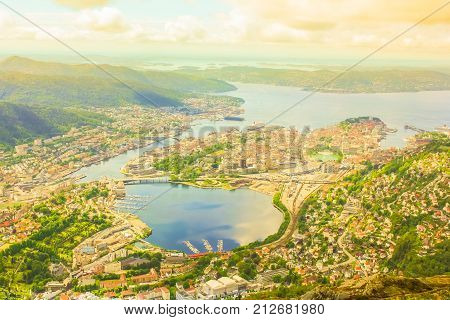 Scenic Bergen aerial view, Norway, Europe. Ulriken mountain is a popular landscape and landmark. Norwegian tourism highlight. Bergen overlook cityscape at sunset. Traveling to Northern Europe