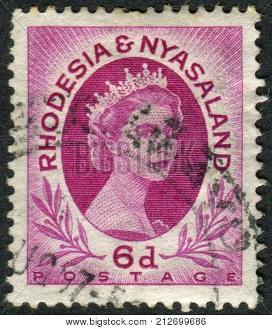 RHODESIA AND NYASALAND - CIRCA 1954: A stamp printed in Federation of Rhodesia and Nyasaland shows a portrait of Queen Elizabeth II circa 1954