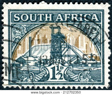 SOUTH AFRICA - CIRCA 1936: Postage stamp printed in South Africa shows Gold Mine circa 1936