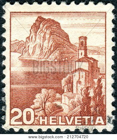 SWITZERLAND - CIRCA 1948: Postage stamp printed in Switzerland shows the church Castagnola Lake Lugano and Monte San Salvatore circa 1948