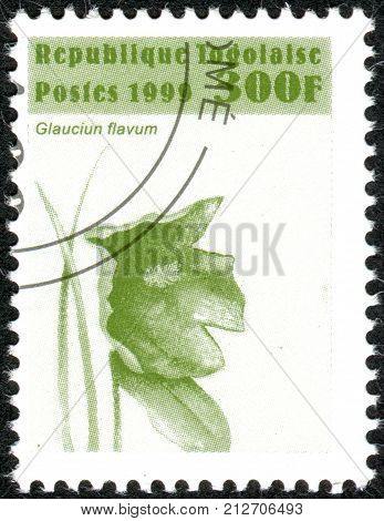 TOGO - CIRCA 1999: A stamp printed in Togo shows the flower Glaucium flavum circa 1999