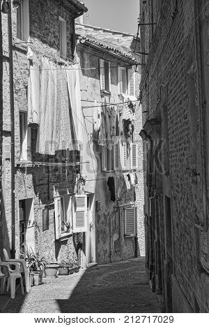 Monte Urano (Fermo Marches Italy): historic town typical street. Black and white
