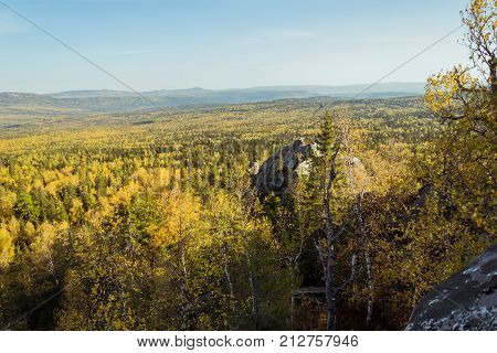 The beginning of autumn in the forests from the height of Taganay mountain