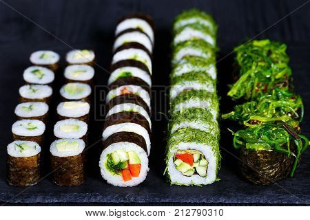 Vegetarian Sushi Menu. Rolls With Cucumber, Futomaki With Vegetables And Gunkan Sushi With Chuka Sal