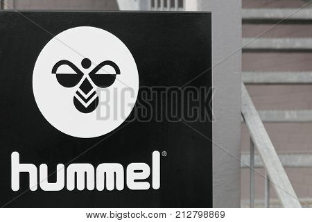 Aarhus, Denmark - July 15, 2017: Hummel logo on a wall. Hummel International is a sportswear company based in Denmark