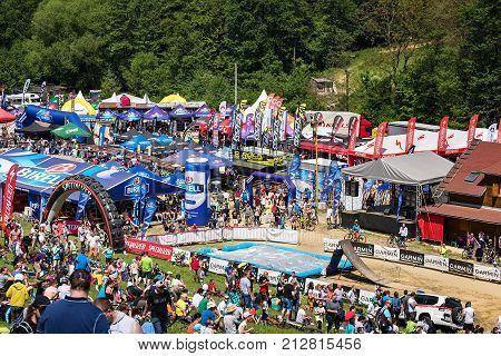 Kalnica, Slovakia - May 27 2017: People Sit On The Slope, Watch And Support Extreme Riders In Bike E