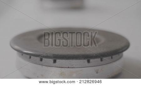 Burning gas plate on home kitchen stove. Modern Gas Stove Plate. Gas burner close up on home plate steel color.