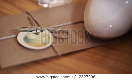 Vintage Package Tied Up With String. Close Up Envelope Sealed. Envelope Of Kraft Paper Tied With Twi
