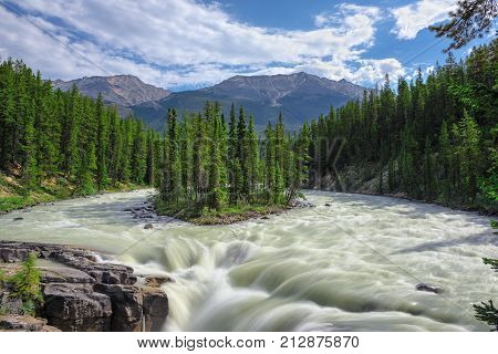 Beautiful Sunwapta falls and island in the Athabasca river, Jasper National Park, Alberta, Canada.