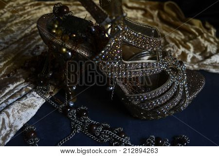 women's Golden slipper with Golden ornaments to create a glamorous image