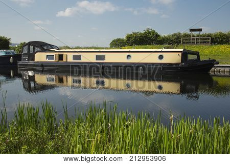 a large barge moored on a canal