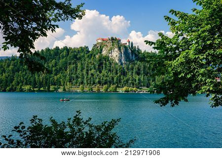 Colorful summer scene on the Bled lake with medieval castle Blejski grad. Slovenia, Europe.