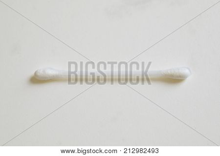 Single qtip on a white background close up macro shot