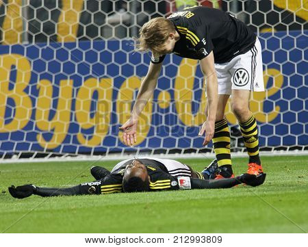 Solna Sweden - Oct 30 2017: Soccer Player Johan Blomberg Helping His Team Mate Henok Goitom Up After