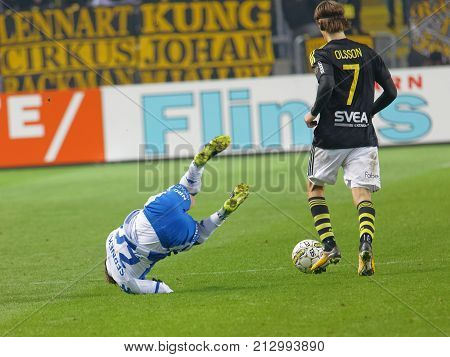 SOLNA SWEDEN - OCT 30 2017: Soccer player Kristoffer Olsson (AIK) make a folding on David Boo (IFK Goteborg). October 30 2017SolnaSweden