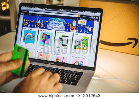 Paris, France - Jul 16 2019: Man Pov Looking At Amazon United Arab Emirates Prime Day Shopping Deals